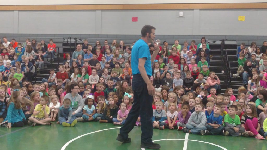 Kids watching the Crazy Tie Guy juggle